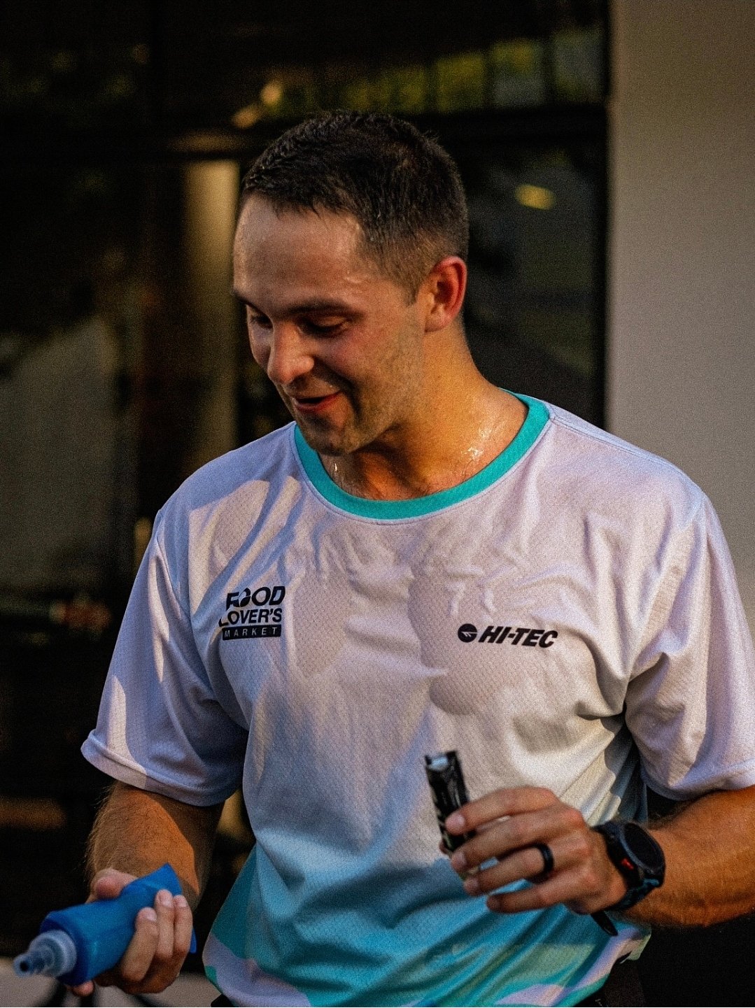 A runner refuelling after the run